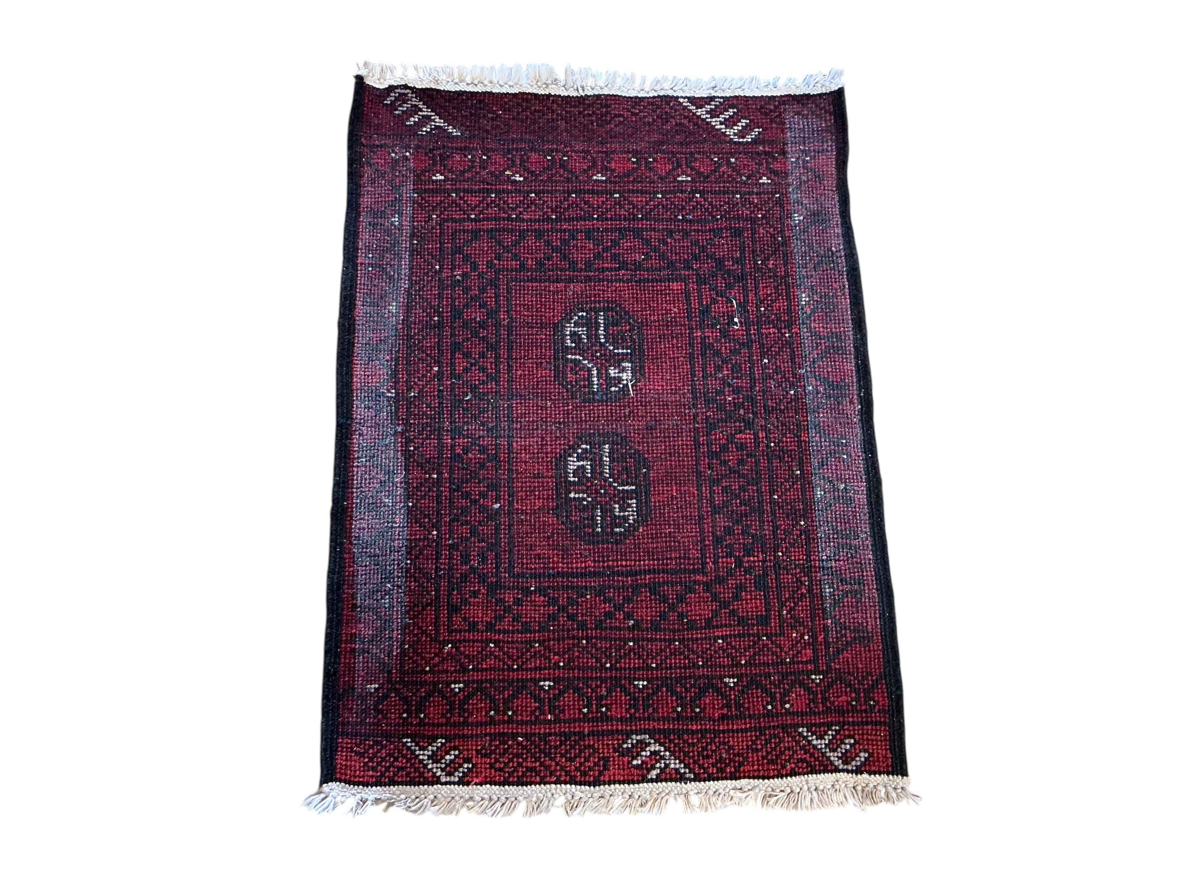A Belouch rug, a Bokhara mat and a Caucasian style rug, largest 230 x 147cm